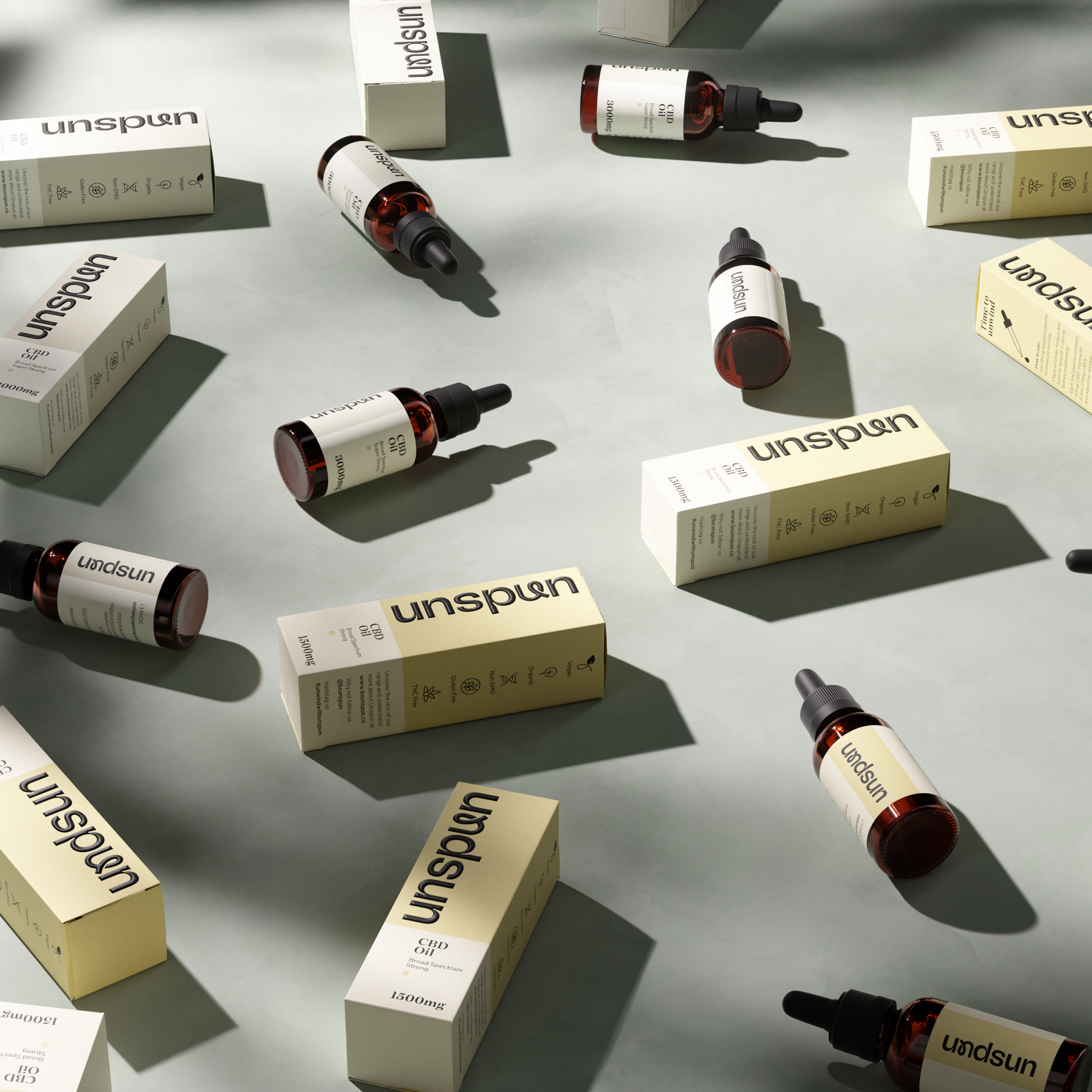 An array of Unspun CBD oil products artfully arranged, casting soft geometric shadows on a neutral surface. Amber glass bottles with black droppers lie next to their white and beige packaging, prominently featuring the Unspun logo. Each box is labeled with '1500mg' and '30ml,' highlighting the quantity and concentration of the CBD oil inside.